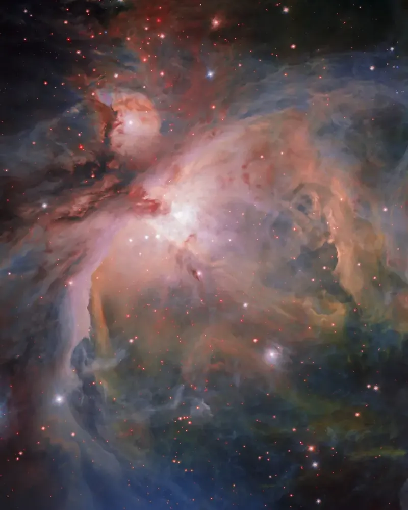 La nébuleuse d’Orion, nuages roses et bleus où naissent de jeunes étoiles