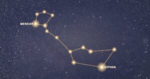 Constellation de la Baleine tracée en or sur fond de ciel étoilé, avec Diphda et Menkar